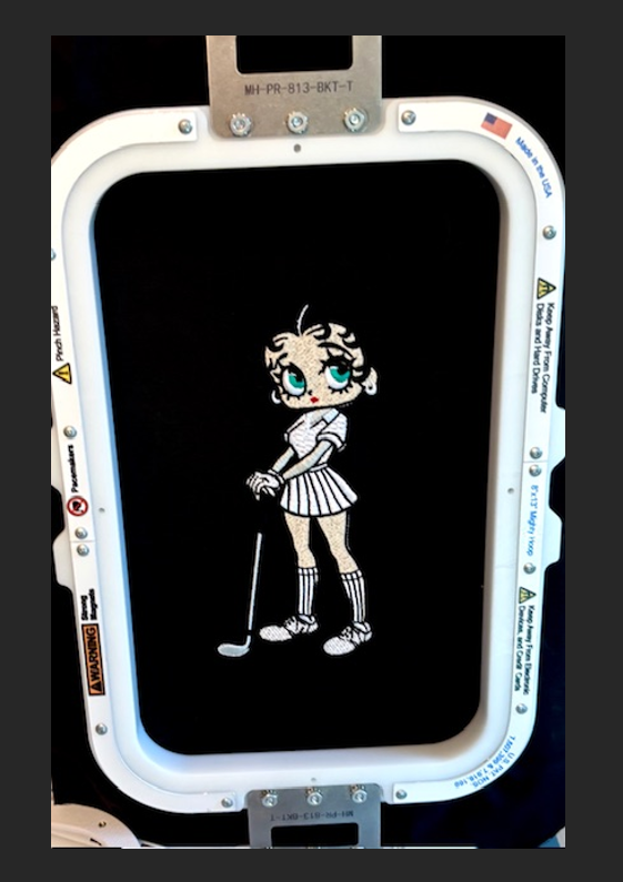 Betty Boop with green eyes, black hair, in golf gear! - NOT included in this listing. Stiches Beautifully!