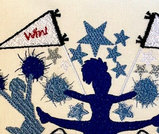 Featuring three iconic jump poses alongside a megaphone, pom-poms, and energetic pendants commanding your team win! Design Stitched out! Close up.