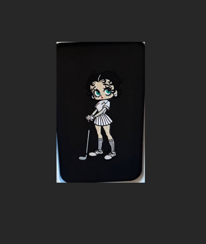 Betty Boop with green eyes, black hair, in golf gear!  - NOT included in this listing.  Stiches Beautifully! 